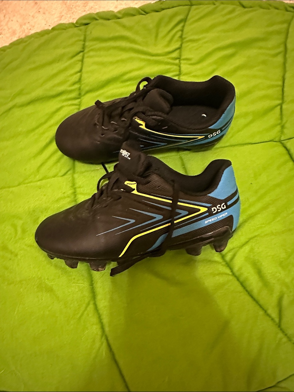 DSG Black Soccer Cleats with Blue and Yellow Accents